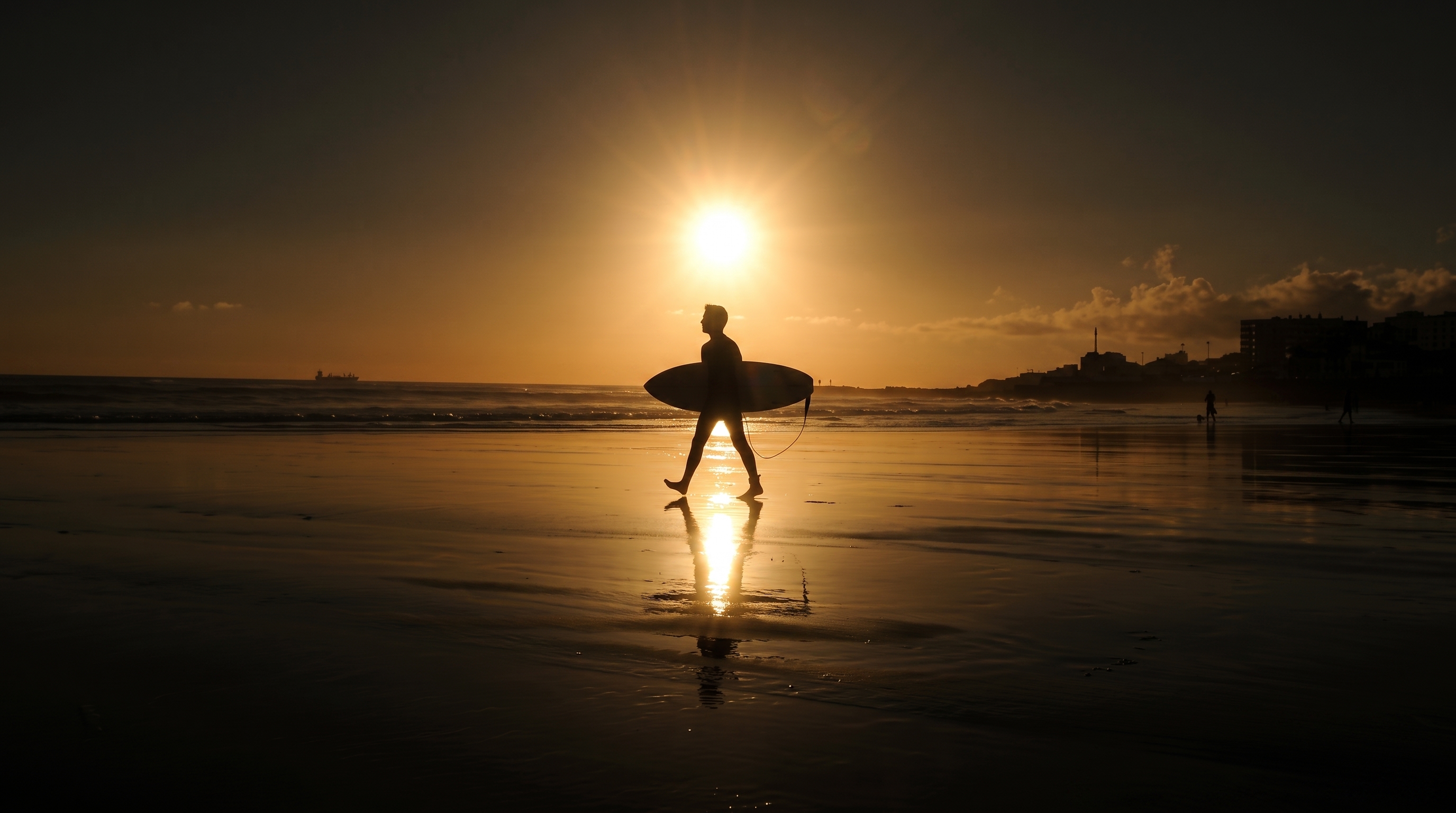 Portugal beach and surfers in the Algarve region