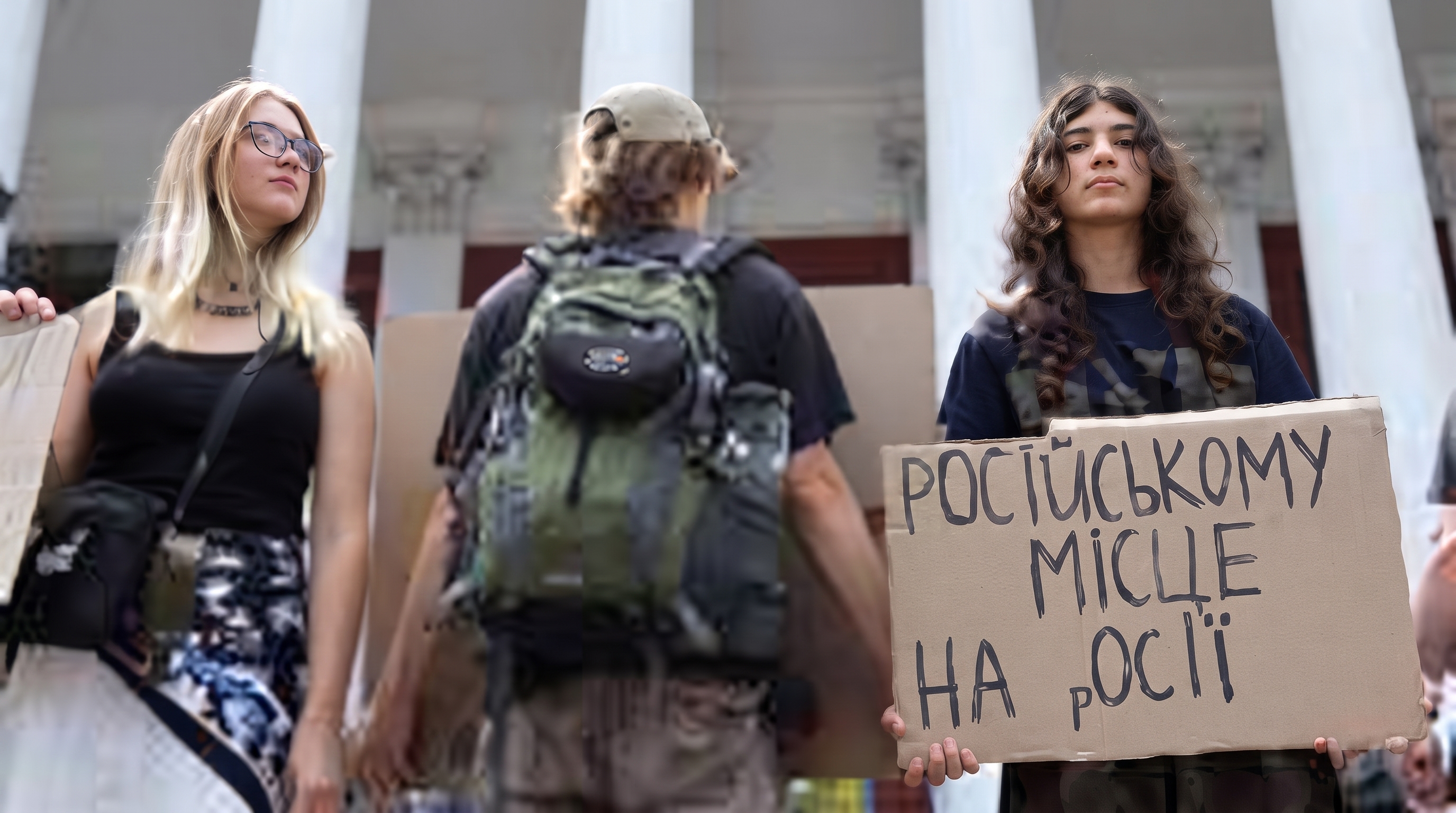 Activists in Odesa hold signs about Russian language ban