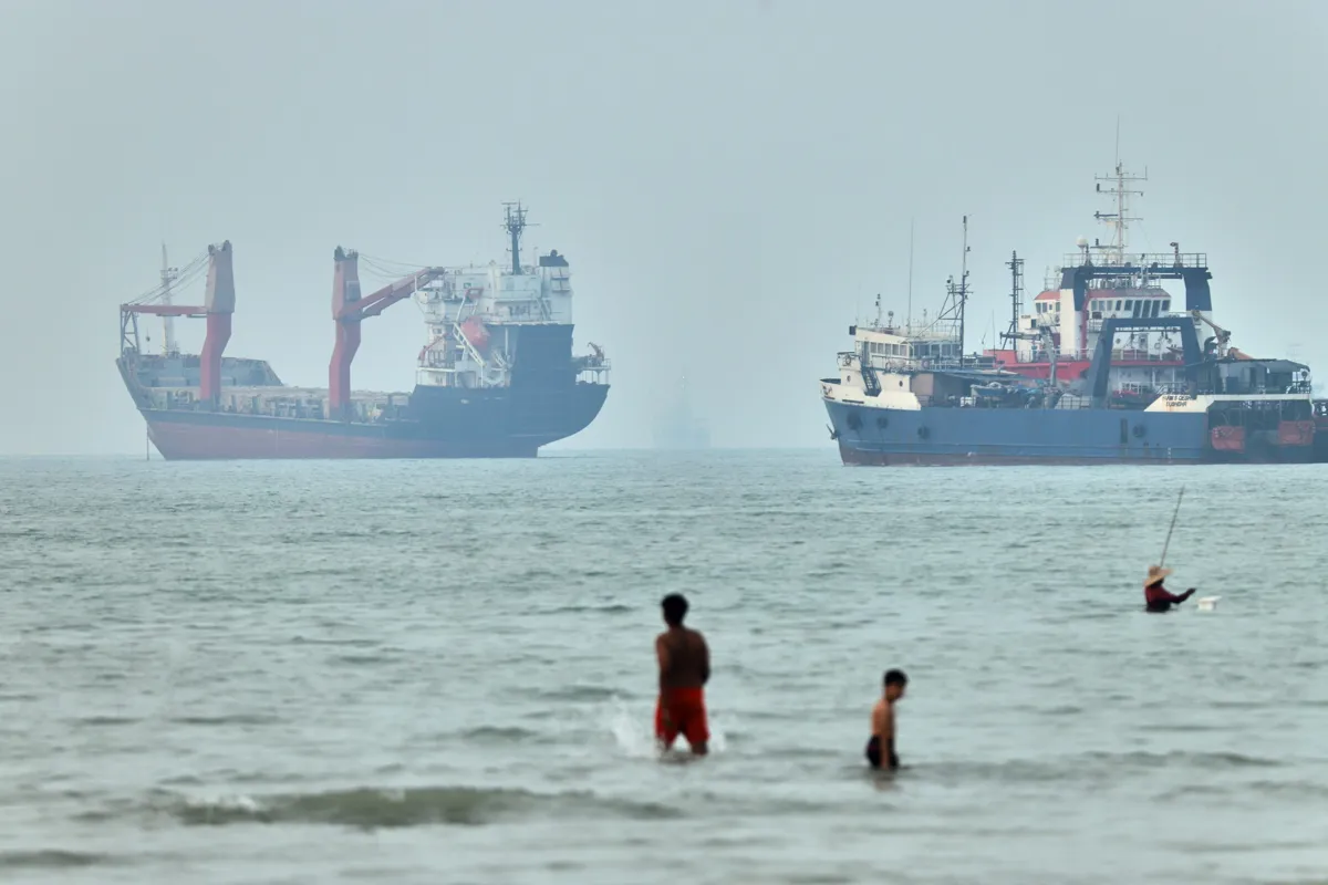 Strait of Hormuz cargo ships Iran 2026 IMF global growth forecast