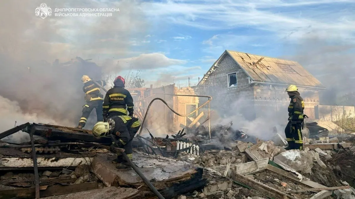 Rescuers at a destroyed house in Dnipro after a Russian attack