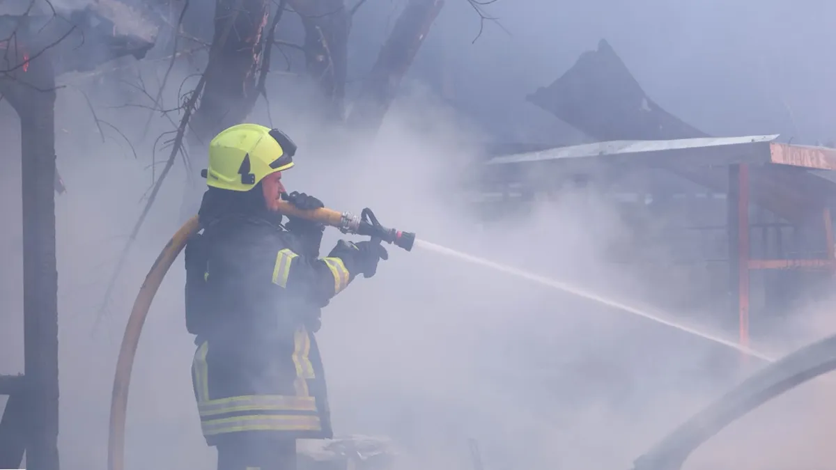Firefighters at a logistics complex in Kyiv Oblast after a drone strike
