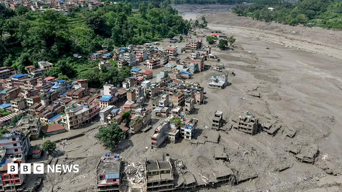 Floodwaters sweeping through a valley on the Nepal-Tibet border