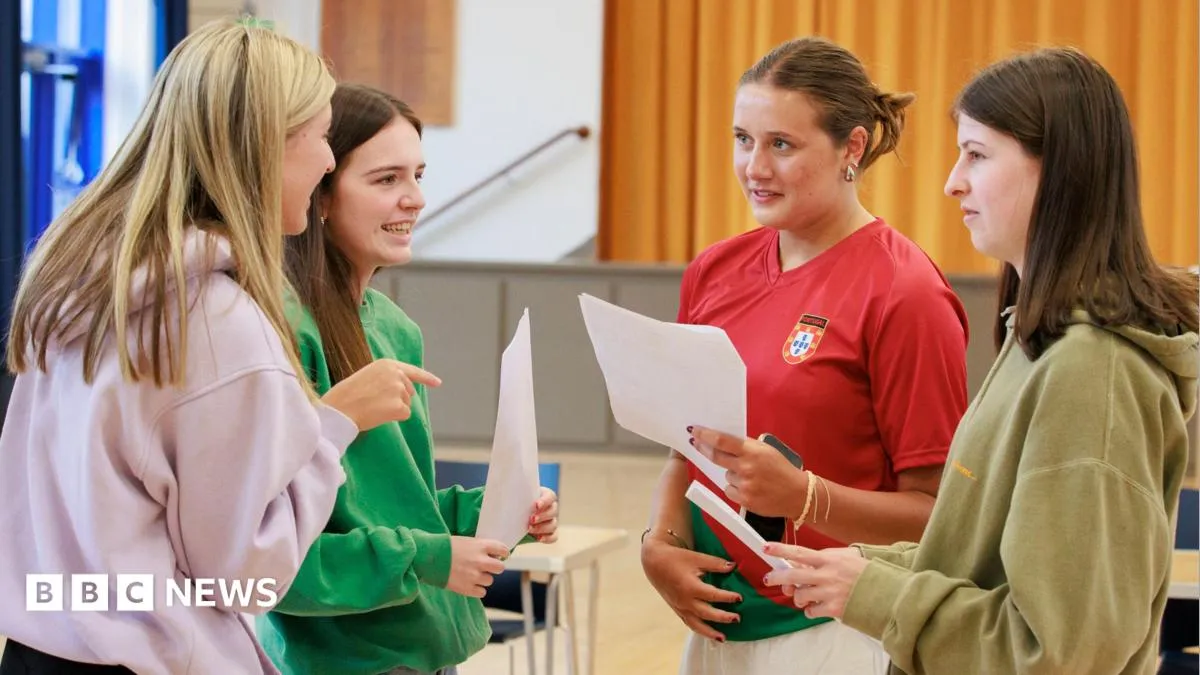 Students opening A-level results envelopes